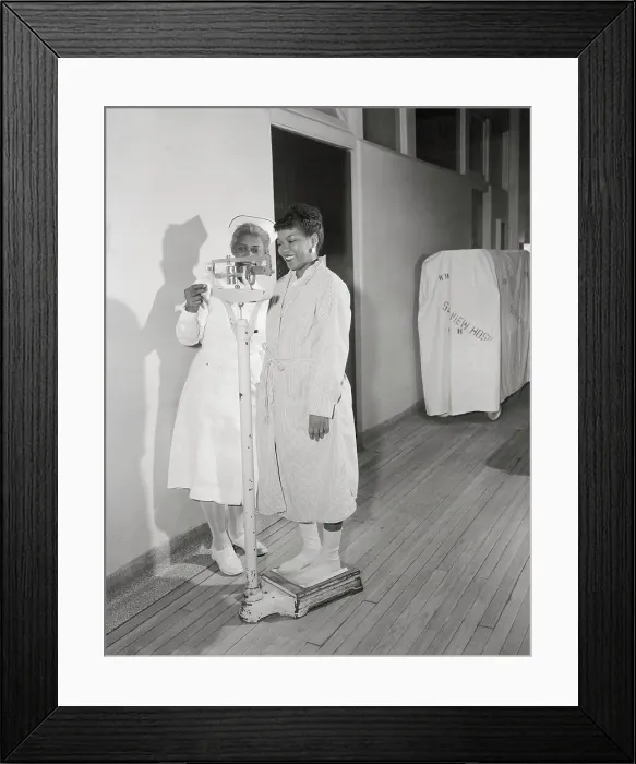 Framed Print : Nurse Weighing Patient Framed Print : Nurse Weighing Patient