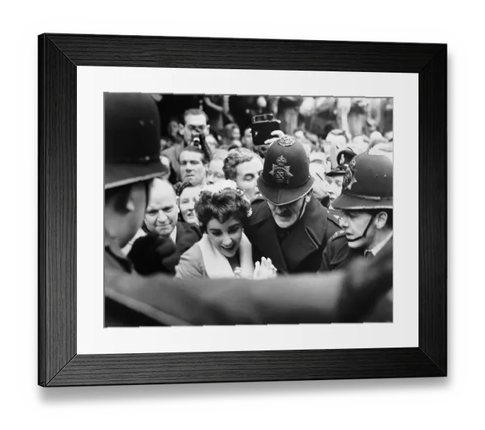 Framed Print : Police Help Liz Taylor Through Crowd Framed Print : Police Help Liz Taylor Through Crowd