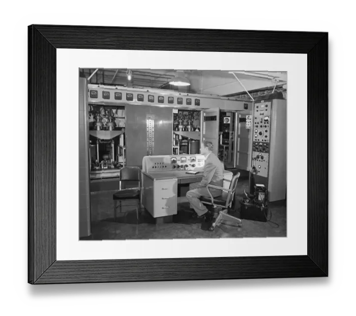 Framed Print : Man Seated at Control Panel Of Radio Stat Framed Print : Man Seated at Control Panel Of Radio Stat