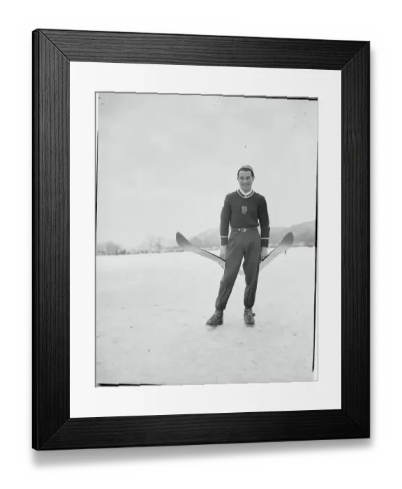 Framed Print : Art Devlin Holding a Pair of Skis Framed Print : Art Devlin Holding a Pair of Skis