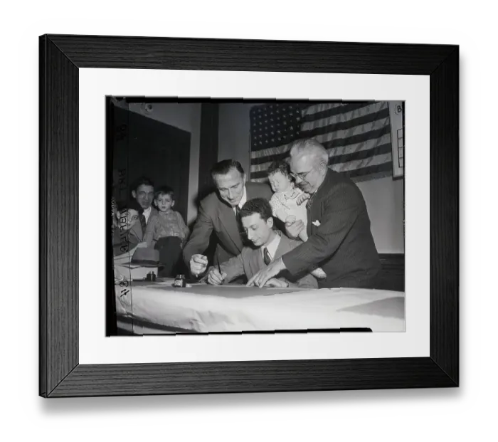 Framed Print : Man Fills Out Immigration Form At Hias Framed Print : Man Fills Out Immigration Form At Hias