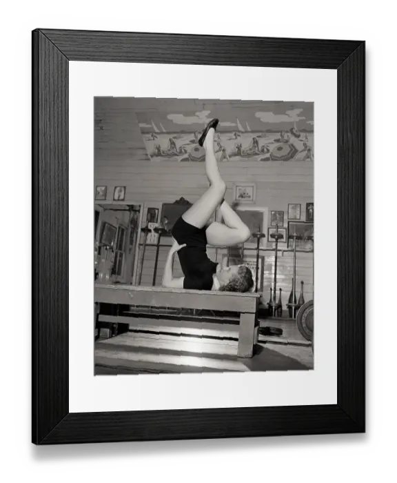 Framed Print : Woman Doing Exercise With Legs In Air