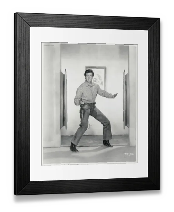Framed Print : Rock Hudson Holding a Gun Framed Print : Rock Hudson Holding a Gun