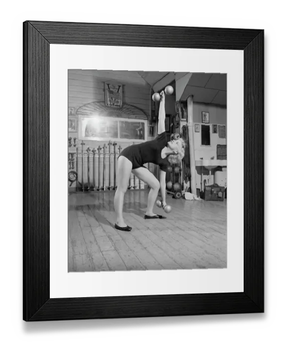 Framed Print : Woman Standing Exercising With Barbells Framed Print : Woman Standing Exercising With Barbells