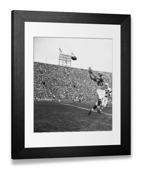 Framed Print : Elroy Hirsch up in the Air to Catch Football Framed Print : Elroy Hirsch up in the Air to Catch Football