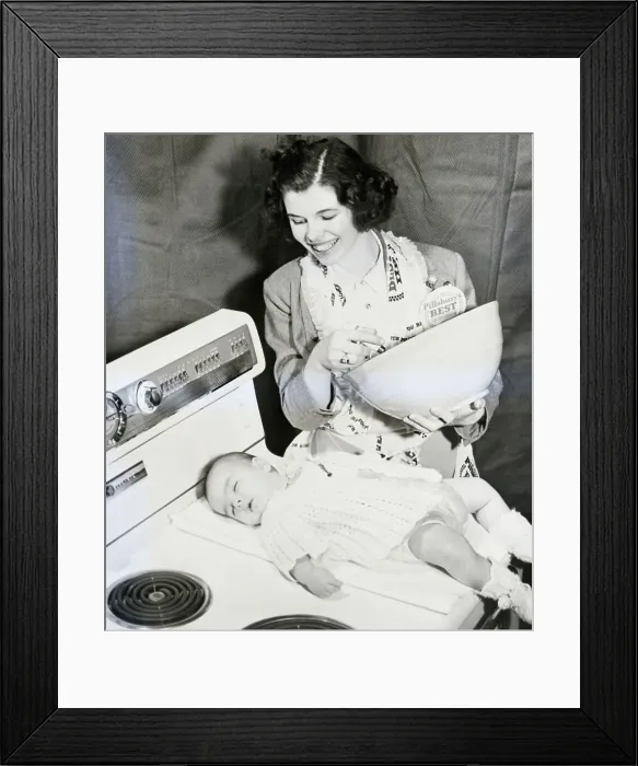 Framed Print : Woman With Sleeping Daughter During Cooking Competition Framed Print : Woman With Sleeping Daughter During Cooking Competition