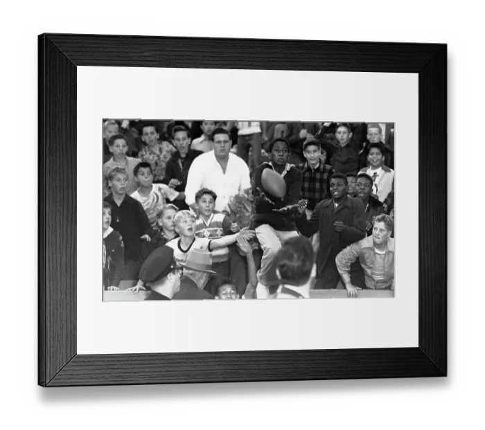 Framed Print : Youth Catches Football - Chicago Cards Vs Los Angeles Rams