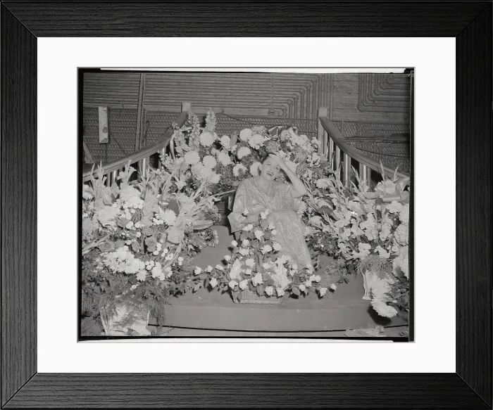 Framed Print : Judy Garland Sitting in Huge Flower Display Framed Print : Judy Garland Sitting in Huge Flower Display