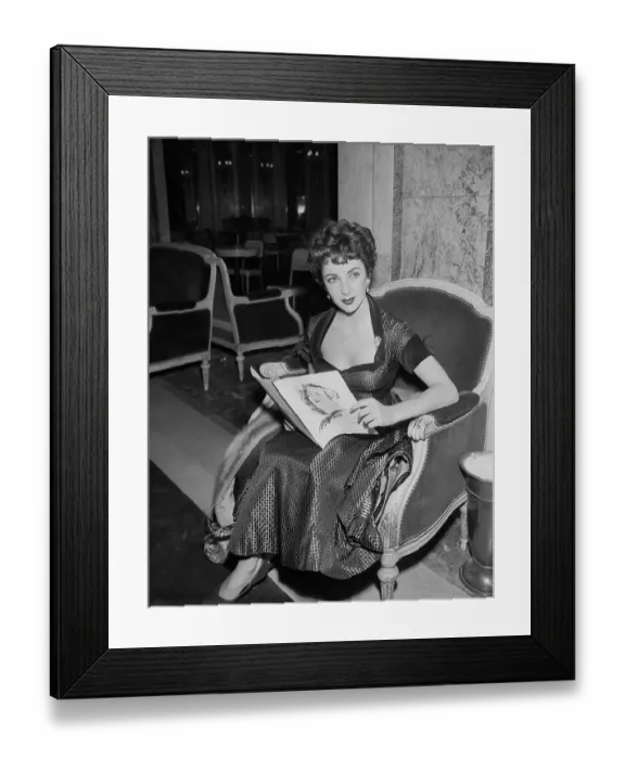 Framed Print : Elizabeth Taylor Sitting in Chair Framed Print : Elizabeth Taylor Sitting in Chair