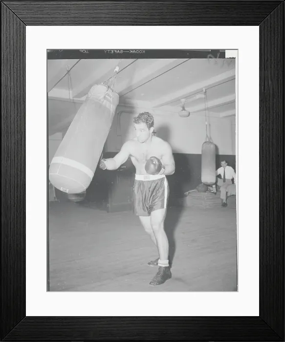 Framed Print : Boxing Champion Rocky Marciano Training with Boxing Bag Framed Print : Boxing Champion Rocky Marciano Training with Boxing Bag