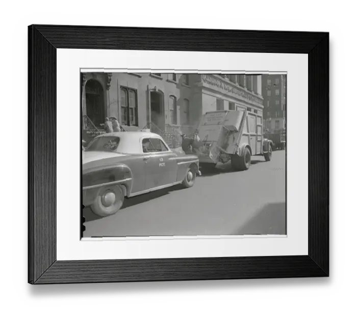 Framed Print : Man Loading Garbage Into Truck Framed Print : Man Loading Garbage Into Truck