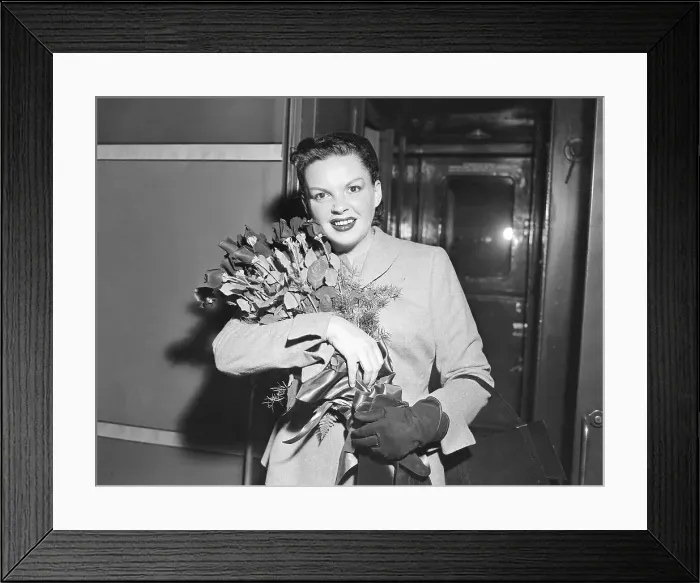 Framed Print : Judy Garland Holding Flowers in Her Arms Framed Print : Judy Garland Holding Flowers in Her Arms