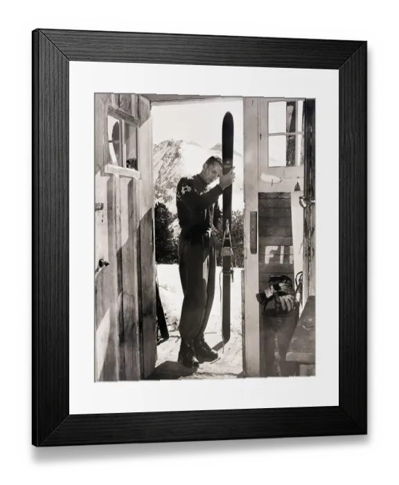 Framed Print : Jack Redding Checking Out Skis in Doorway Framed Print : Jack Redding Checking Out Skis in Doorway