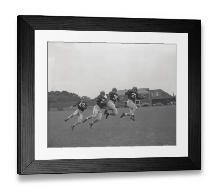Framed Print : Football Players Working out on Field Framed Print : Football Players Working out on Field