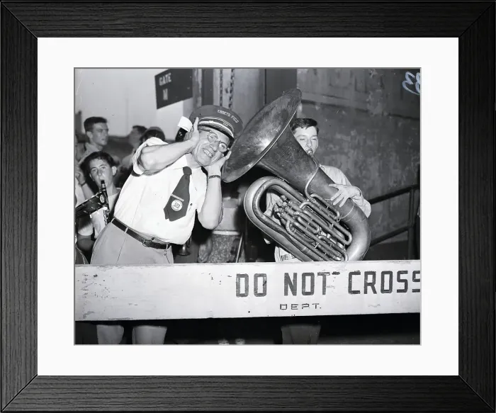 Framed Print : Tuba Player With Gate Keeper At Stadium