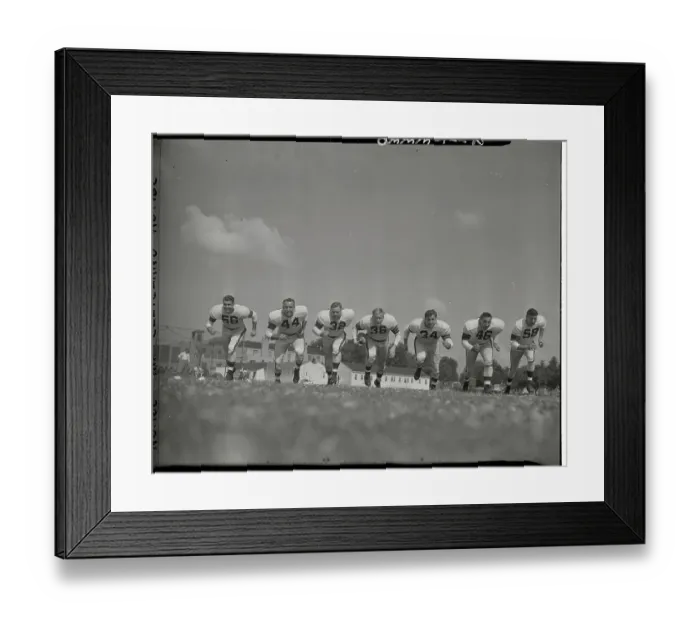 Framed Print : Football Players Running
