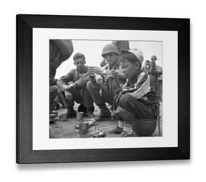 Framed Print : 24th Infantry Division's Adopted Child Al Eats With The G.I.s Framed Print : 24th Infantry Division's Adopted Child Al Eats With The G.I.s