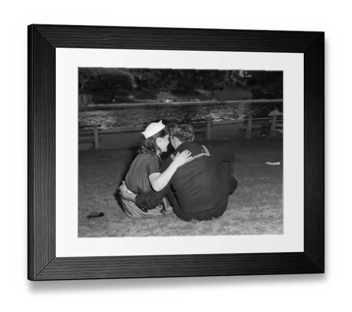 Framed Print : Vintage photograph of sailor and his girlfriend sitting together on grass Framed Print : Vintage photograph of sailor and his girlfriend sitting together on grass