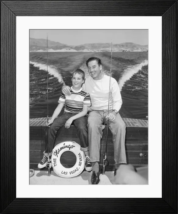 Framed Print : Errol Flynn and Son Posin on Boat Framed Print : Errol Flynn and Son Posin on Boat