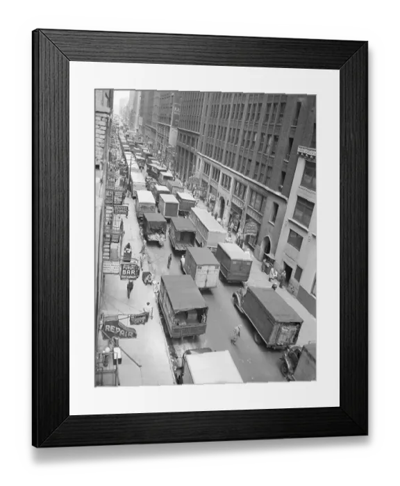 Framed Print : Trucks Parked and in Slow Procession