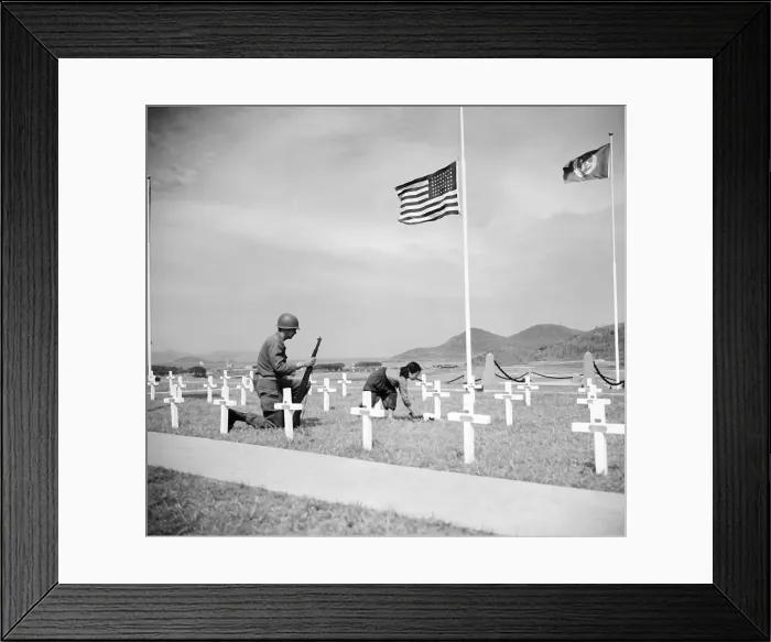 Framed Print : Girl Places Flowers On Grave As Soldder Framed Print : Girl Places Flowers On Grave As Soldder