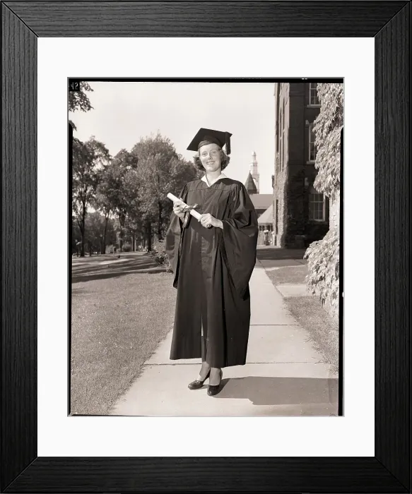 Framed Print : Female Graduate in Cap and Gown with Diploma Framed Print : Female Graduate in Cap and Gown with Diploma