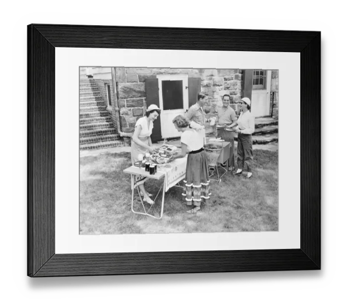 Framed Print : Couple Giving a Backyard Barbecue for Friends Framed Print : Couple Giving a Backyard Barbecue for Friends
