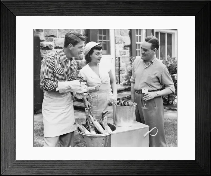 Framed Print : Group Preparing Corn For Cooking