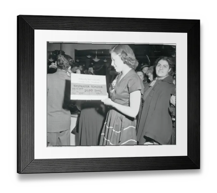 Framed Print : Woman Looking at a Price Card Framed Print : Woman Looking at a Price Card