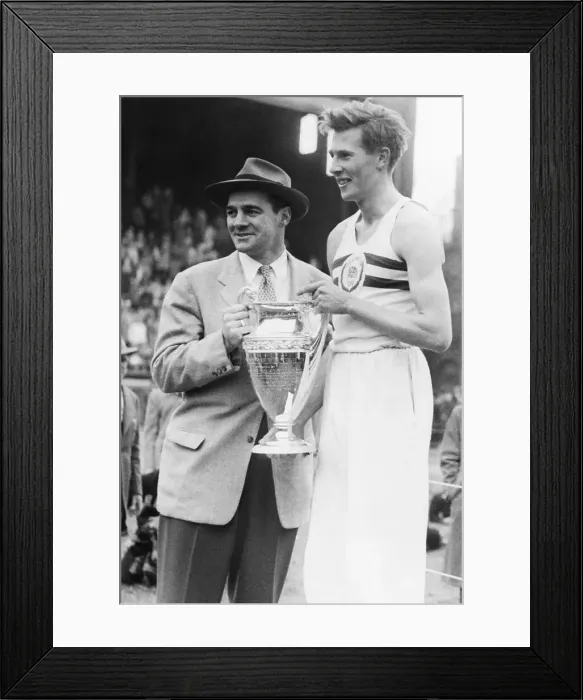 Framed Print : Roger Bannister Holding the Winner's Cup