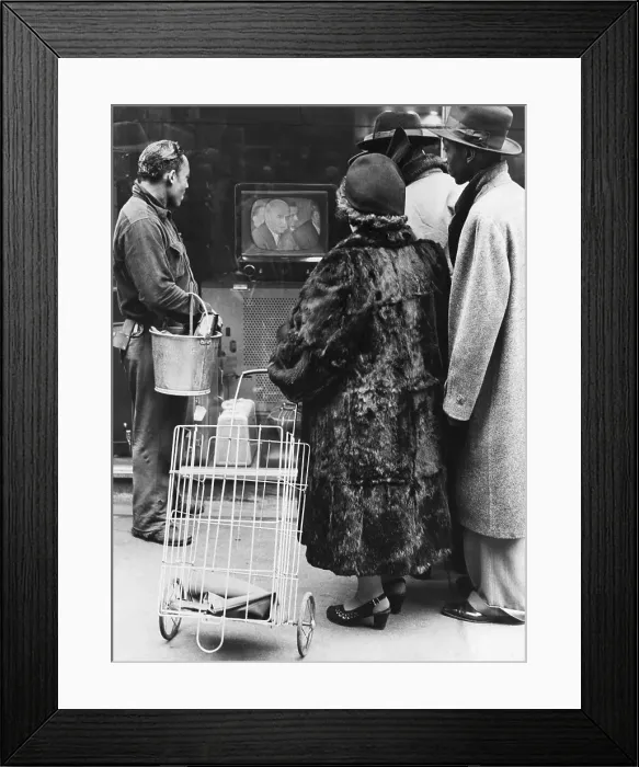 Framed Print : Pedestrians Watch TV in Store Window Framed Print : Pedestrians Watch TV in Store Window