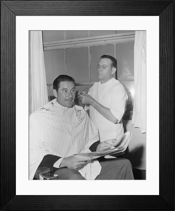 Framed Print : Errol Flynn Getting Haircut Framed Print : Errol Flynn Getting Haircut