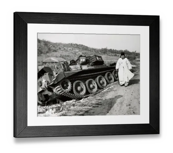 Framed Print : A Woman Refugee Walking Past A Tank Framed Print : A Woman Refugee Walking Past A Tank
