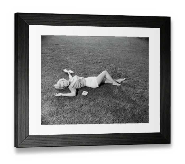 Framed Print : Marilyn Monroe Lying On The Grass Framed Print : Marilyn Monroe Lying On The Grass
