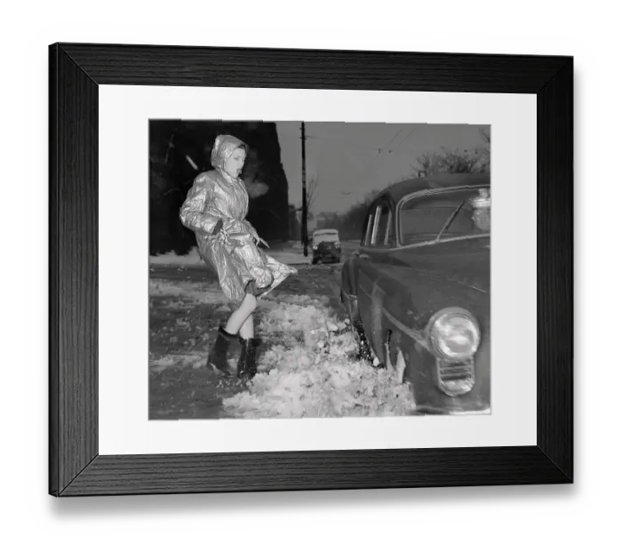 Framed Print : Vintage photograph of trendy young woman splashed over with semi melted snow Framed Print : Vintage photograph of trendy young woman splashed over with semi melted snow