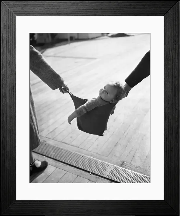 Framed Print : Baby (12-13 months) carried in baby carrier Framed Print : Baby (12-13 months) carried in baby carrier
