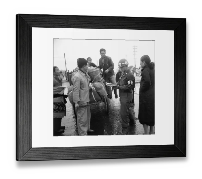 Framed Print : Policeman Checking Refugees Framed Print : Policeman Checking Refugees