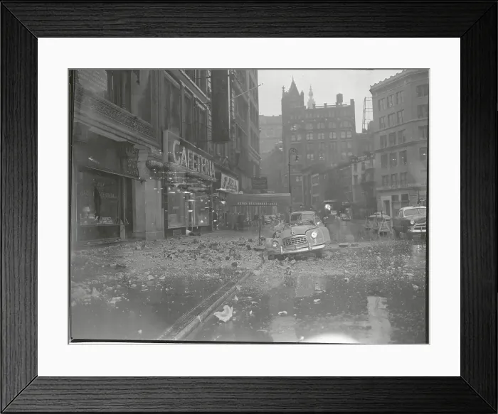 Framed Print : Building Debris on Street