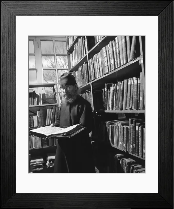 Framed Print : Monk Studying Book In Library Framed Print : Monk Studying Book In Library