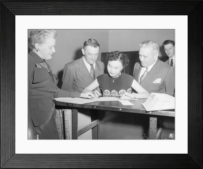 Framed Print : Anna Chennault Signing Naturalization Papers Framed Print : Anna Chennault Signing Naturalization Papers
