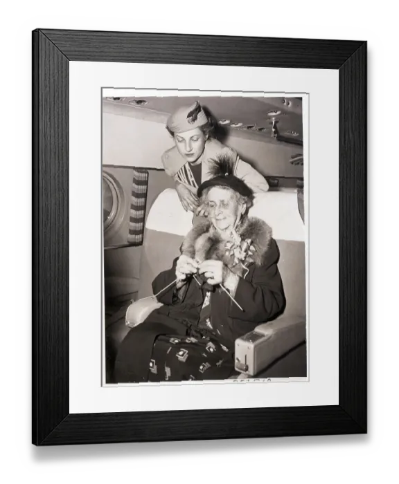 Framed Print : Champion Knitter Gives Tips to Novice