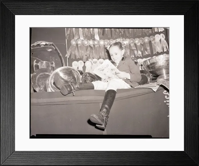 Framed Print : Vicki Mariles Reading with Medal and Trophies Framed Print : Vicki Mariles Reading with Medal and Trophies