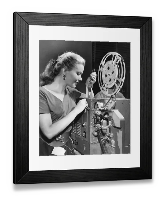 Framed Print : Woman Inserting New Lamp into Projector Framed Print : Woman Inserting New Lamp into Projector