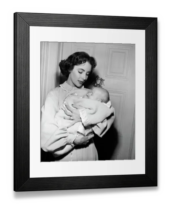 Framed Print : Elizabeth Taylor Holds Baby for Movie Framed Print : Elizabeth Taylor Holds Baby for Movie