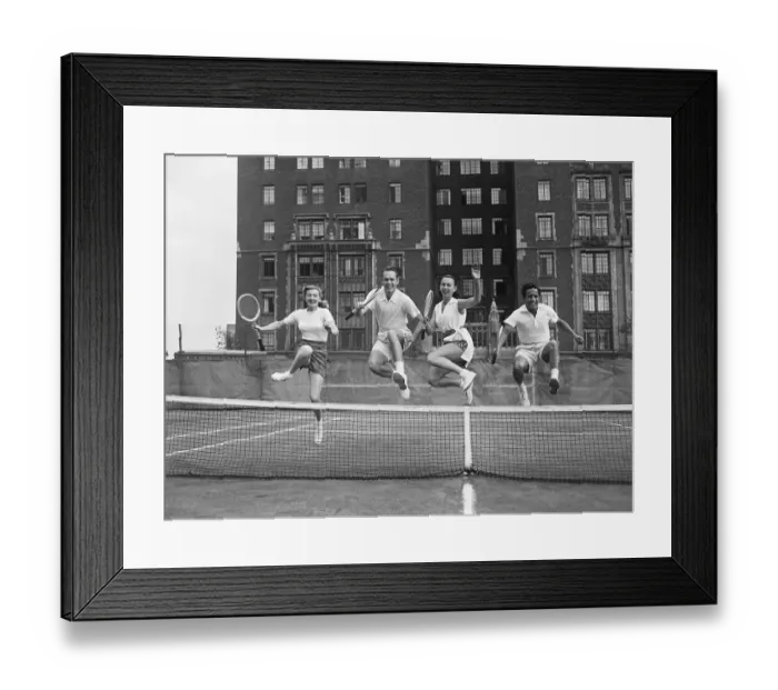 Framed Print : Tennis Players Jumping Over Net Framed Print : Tennis Players Jumping Over Net