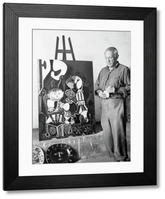 Framed Print : Pablo Picasso Posing with Painting Framed Print : Pablo Picasso Posing with Painting