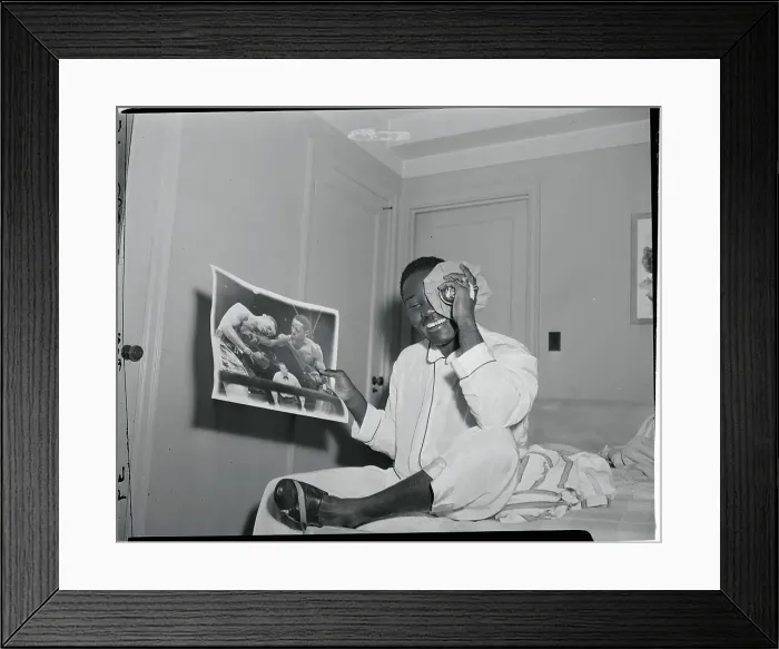 Framed Print : Ezzard Charles Holding a Photograph Framed Print : Ezzard Charles Holding a Photograph