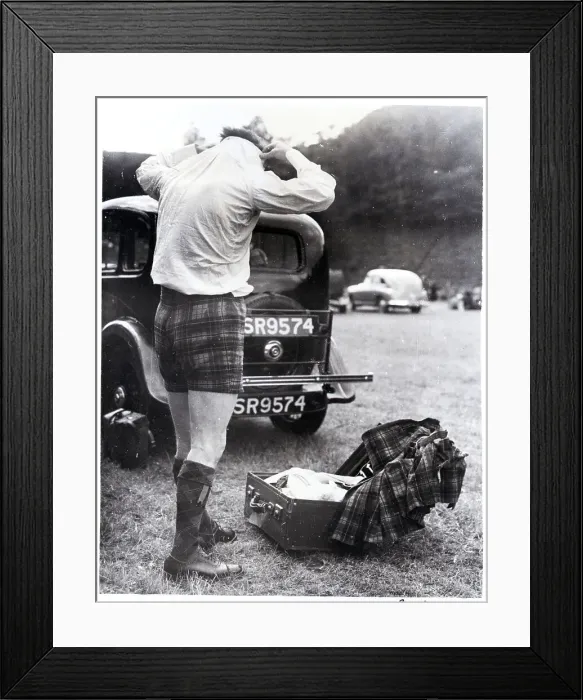 Framed Print : Man Changing Out Of Kilt Framed Print : Man Changing Out Of Kilt