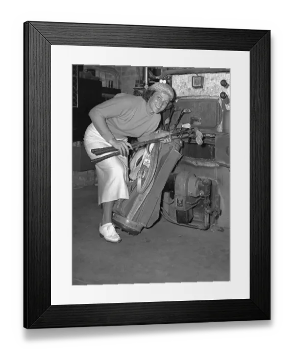 Framed Print : Babe Didrikson Putting Golf Clubs in Furnace
