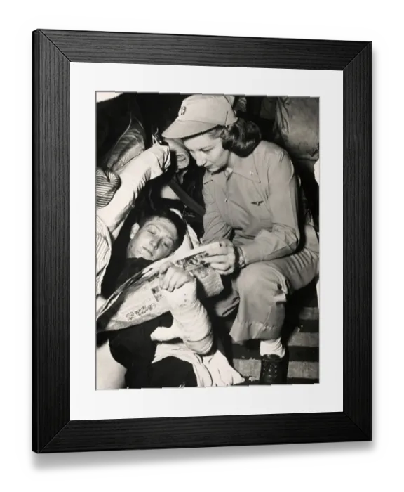 Framed Print : Navy Flight Nurse With Wounded Soldier Framed Print : Navy Flight Nurse With Wounded Soldier